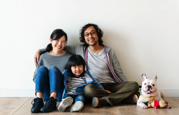 Happy Asian family in new home