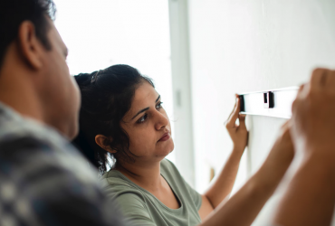 Indian family measuring house